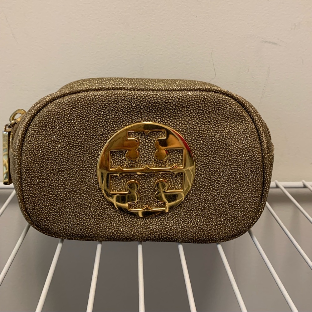 Tory Burch gold tiny cosmetic bag. This is a small bag !!!